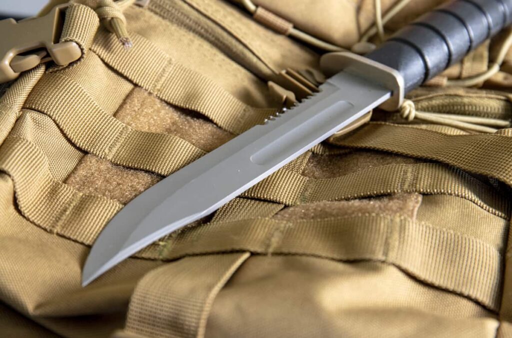 image of Tactical military knives on a yellow bag