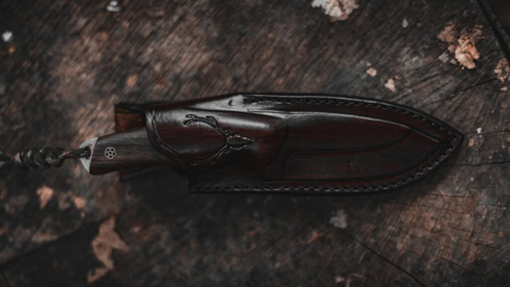 the fixed blade knife storing inside of a leather knife sheath